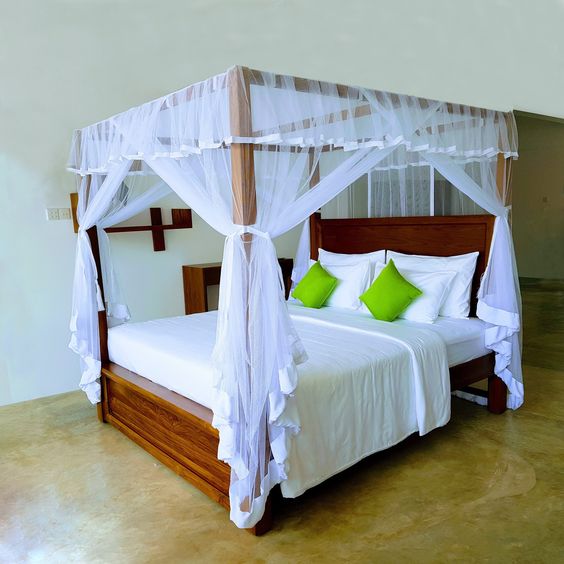 Wooden Canopy Bed with Sheer Curtains