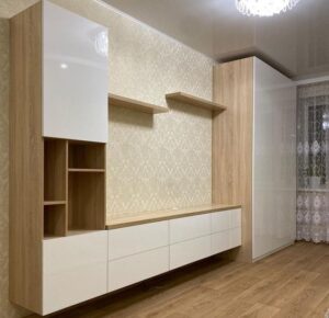 Sleek Wall-Mounted TV Panel with Floating Shelves